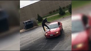 Skater Rides A Rail And The Hood Of His Car