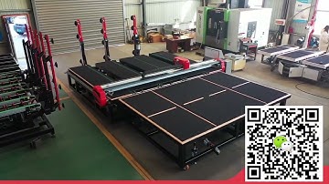 CNC Glass Cutting Machine with automatic glass loading arms and separate glass breaking table