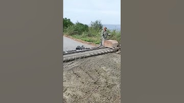 Concrete pavement single axis roller paving process