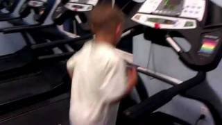 very funny Kid does a flip with a gym ball