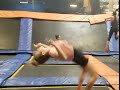 Two Girls Jumping On Trampolines 