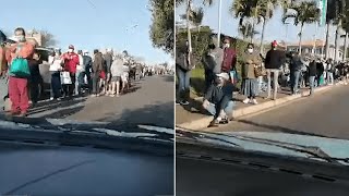 video: Watch - South Africa riots: Woman sobs as she sees huge queue of people desperate for food