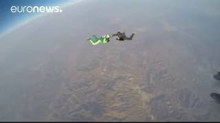 Skydiver Luke Aikins makes history by successfully jumping without a parachute from 7.6km (25,000ft) in California.

What are the top stories today? Click to watch: https://www.youtube.com/playlist?li