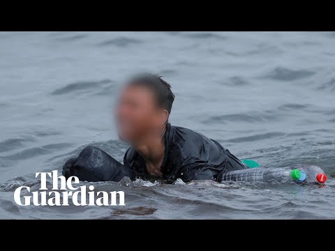 Migrant boy swims to beach in Spain's Ceuta with plastic bottles to stay afloat