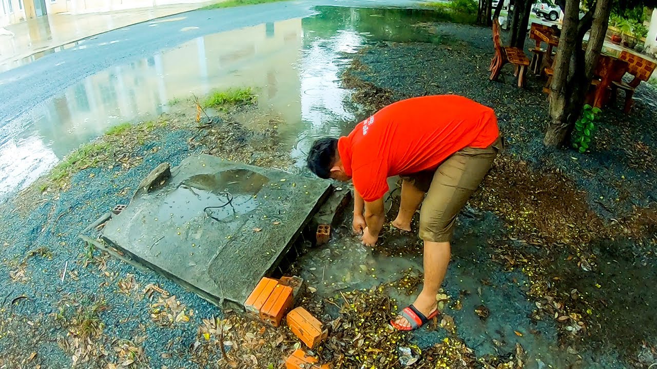 Unclogging Culvert Drain Rain Water - Remove Debris Clogged Drain - YouTube