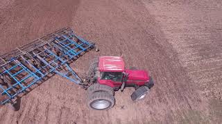 CaseIH 8950 tilling field ahead of  International Harvester 5088 planting corn