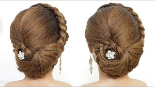 Bun updo with braid. Hairstyle for long hair