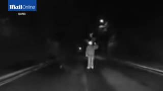 Terrifying dash cam shows clown run towards car on dark road