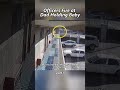 Police shoot father holding a baby.