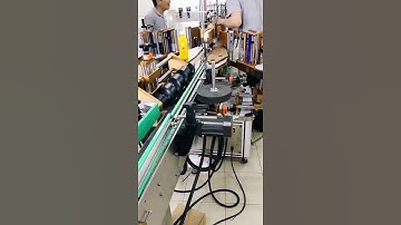 Adjusting video of bottle labeling machine with bottle spacing roll feeding system