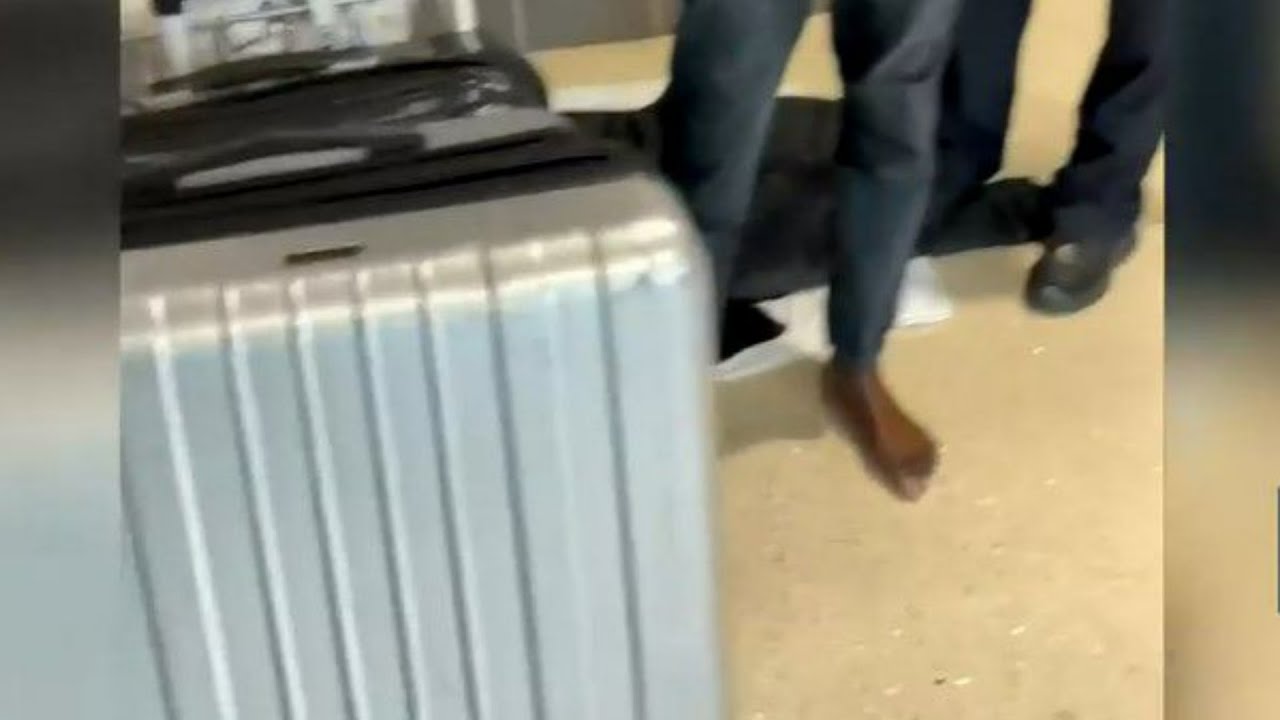 Man tracks stolen luggage at Atlanta's airport, finds man wearing his