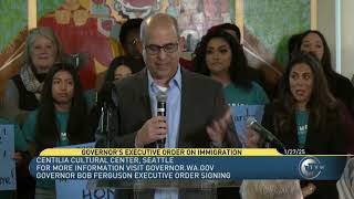 Governor Bob Ferguson signing executive order on immigration