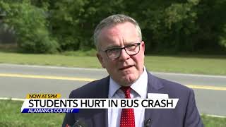 Driver charged after 7 students hurt when bus crashes into building