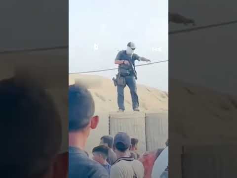 GHF Security Guard Fires Tear Gas At Aid Seekers In Gaza