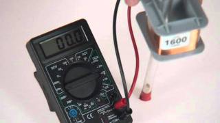 Falling magnet through coil