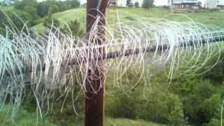 Delashing wire from cable strand.
