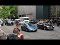 Melissa McCarthy as Sean Spicer podiums on a NYC street, May 12, 2017