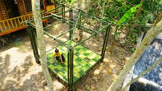 Building bamboo cabin beside the stream - Big floods of the tropical rainy season