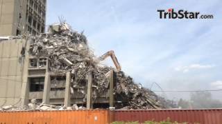 Crews clear debris from the ISU Statesman Towers' east building. The towers' demolition should be co
