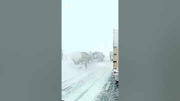 Snow covered roads cause chaos for semi-trailer trucks