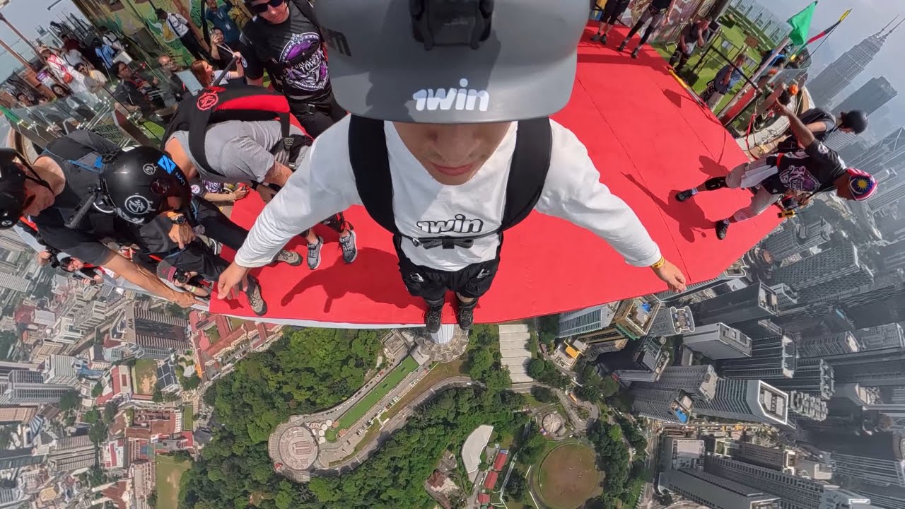 Triple frontflip - BASE jump from KL Tower #1win_extreme - YouTube