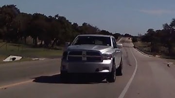 Driver Avoids Head-On Collision With Truck