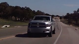 Driver Avoids Head-On Collision With Truck