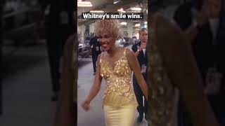 Whitney's smile wins.
