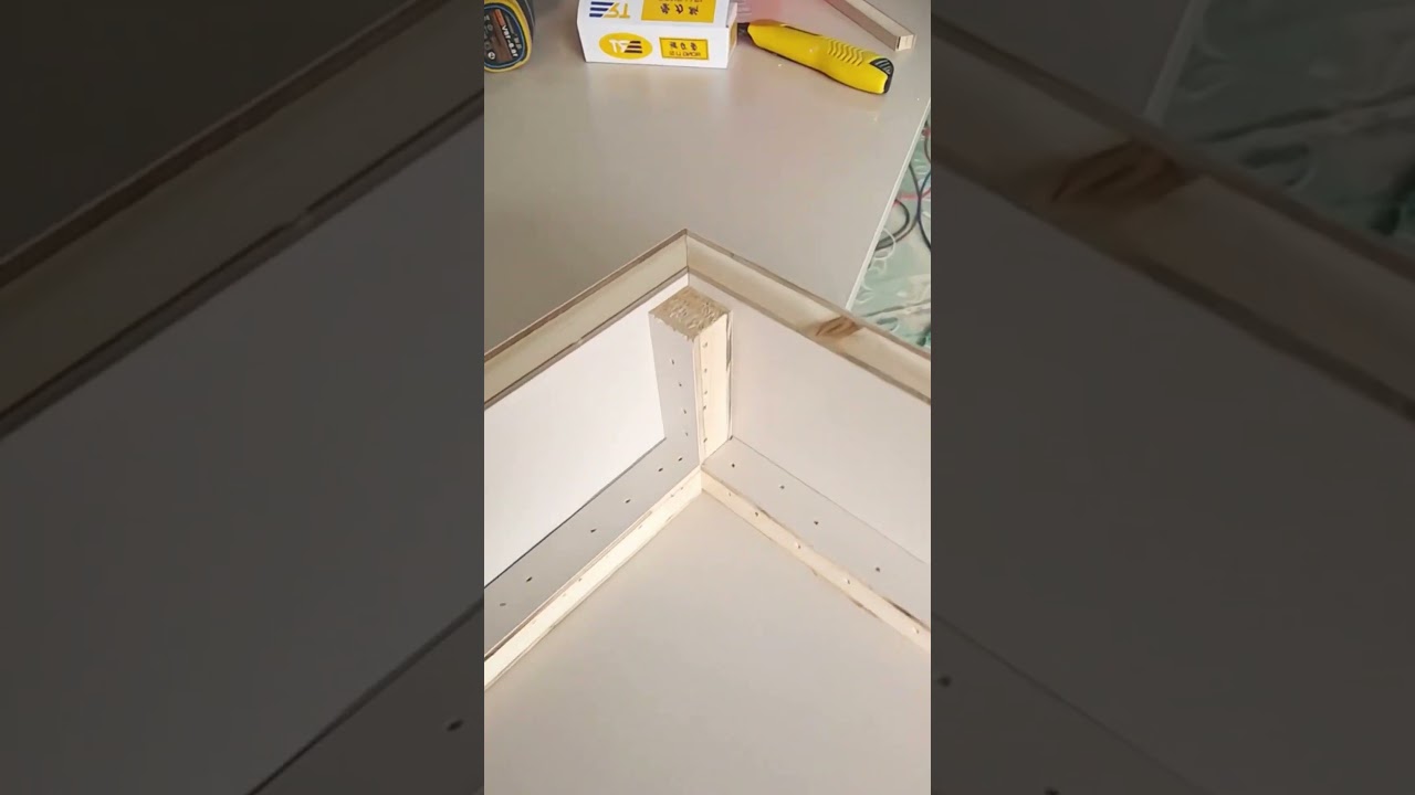 The process of applying paint to wood to give it color 