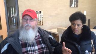 Police escort Flint man from Flint water meeting, argues face-to-face with mayor