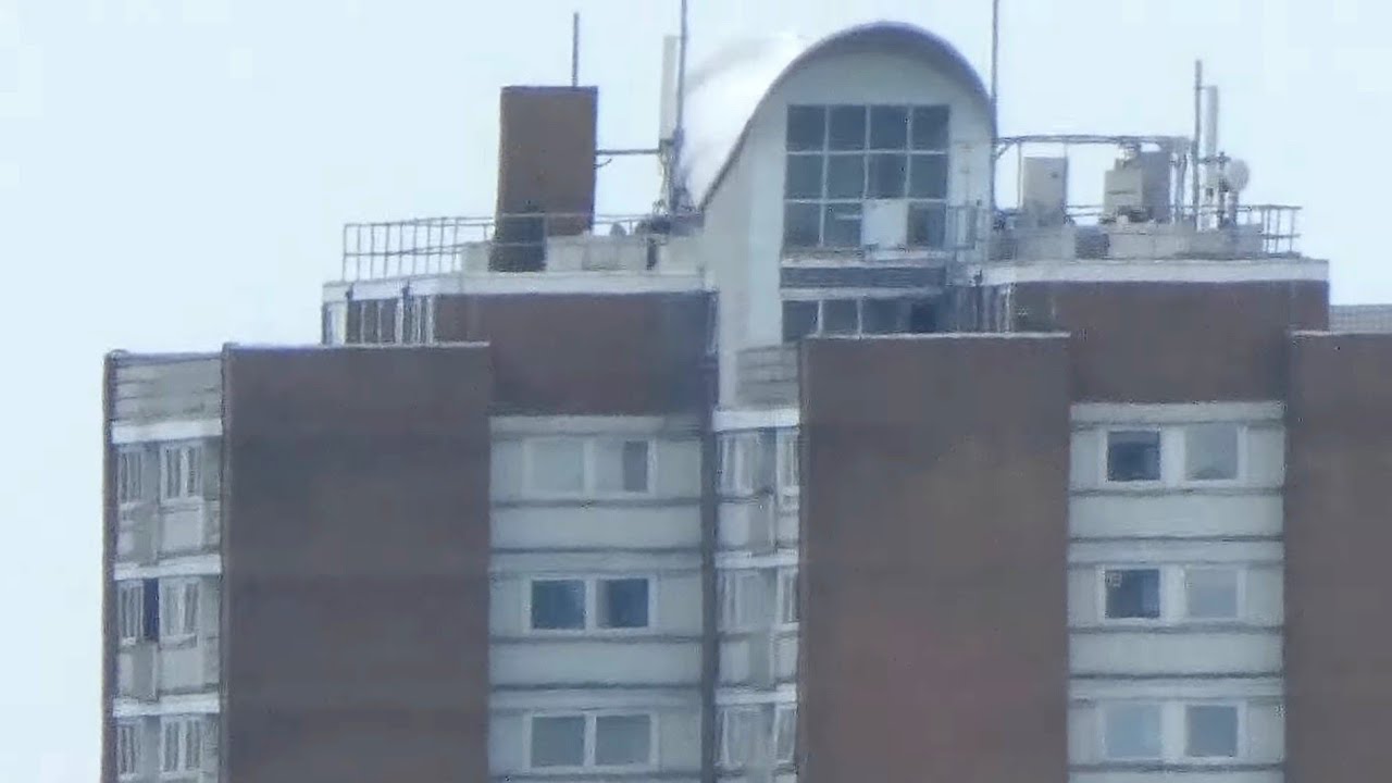 Camera Zooms on High Rise Flats 3km Away