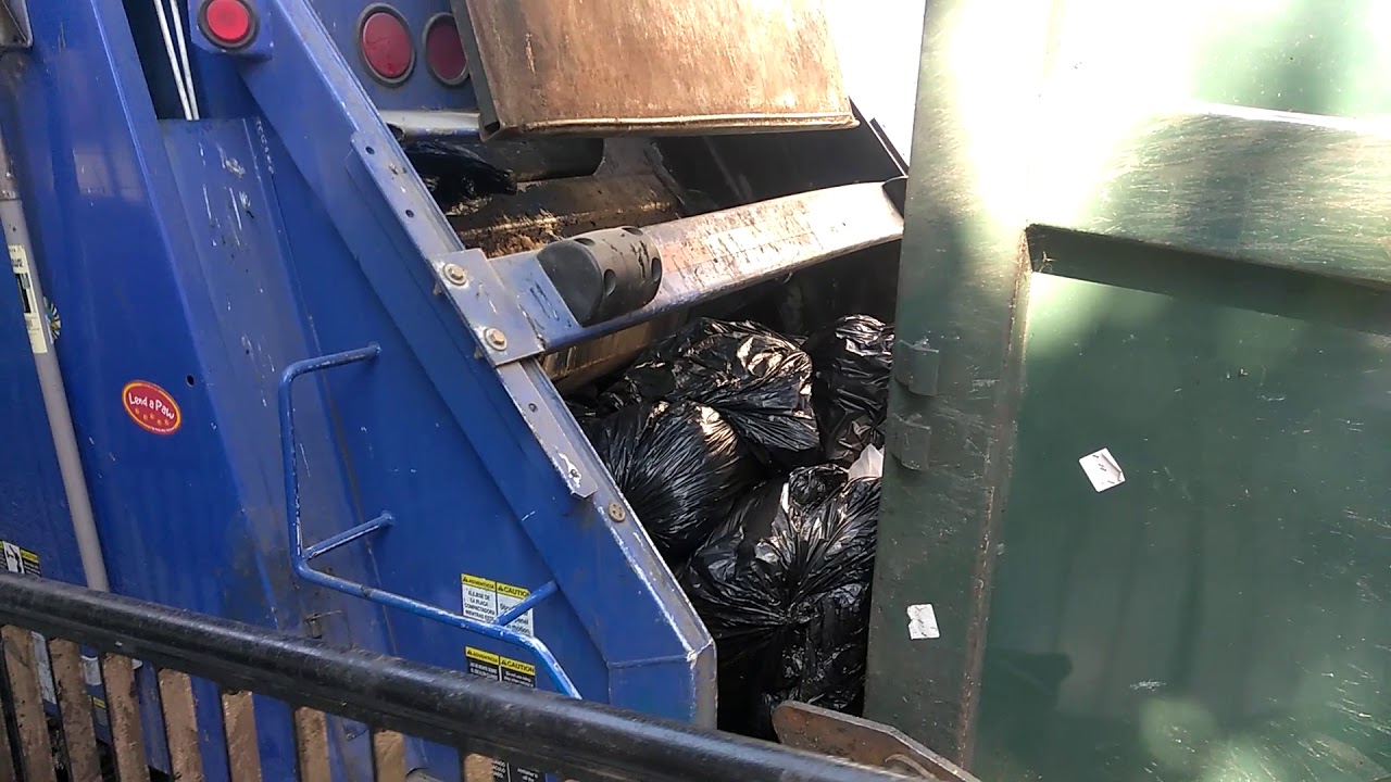 Full compactor in Newark Delaware gets emptied - YouTube