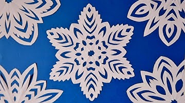 Paper snowflake tutorial - learn how to make snowflakes in 5 minutes - Julia Datta 2020