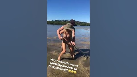 Chris Hemsworth and Elsa Pataky riding each others while finding yabbies