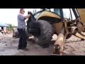 Changing a tire on a backhoe 19.5L-24