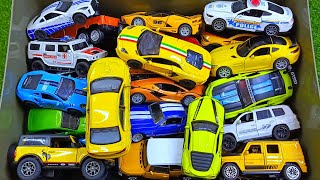 Box full of various miniature cars Toyota Vellfire, Land Rover Defender, Range Rover, Maybach 80