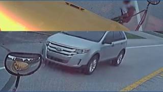 Driver ignores stopped school bus, nearly hits child in KY