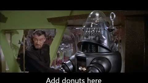 FORBIDDEN PLANET- Robby the robot makes Donuts for lunch in his chemical laboratory.