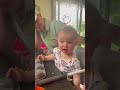 Baby tries lemon for the first time