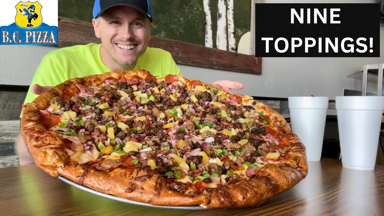 FREE FOOD FOR A YEAR IF YOU FINISH THIS 20'' NINE TOPPING PIZZA