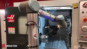Lincoln Tech’s Advanced Manufacturing Program demonstrates a robotic arm on a Haas CNC Machine