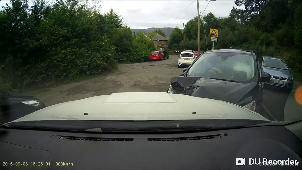 Car tries to overtake another car but hits a car parked off the road