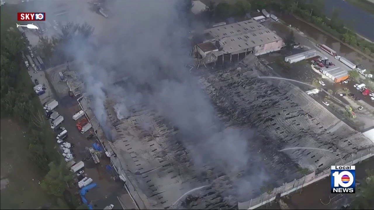 Massive warehouse fire continues burning in northwest Miami-Dade - YouTube