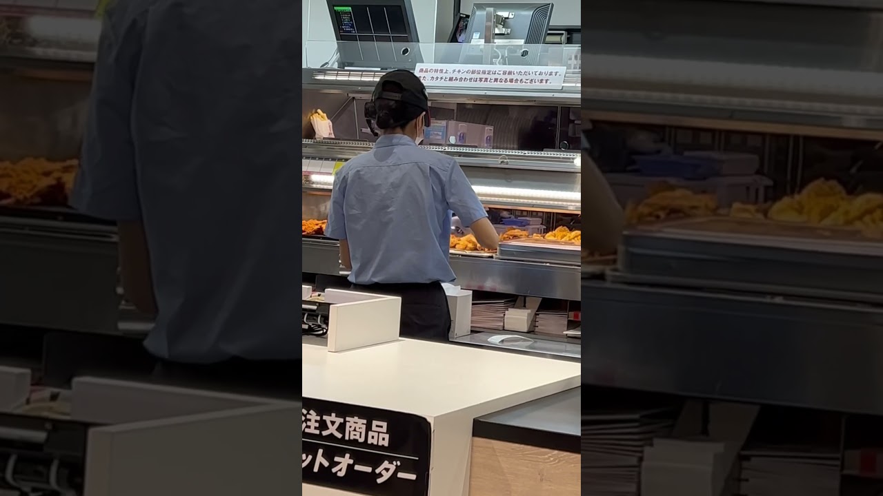 KFC staff workers are preparing  take out orders 