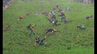 Dramatic footage of people throwing themselves down Cooper's Hill a...