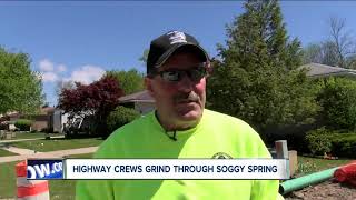 Road construction crews continue with repairs despite wet and cold spring