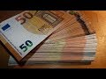 Counting stack of 50 EURO banknotes new and old CASH