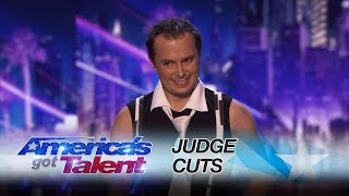 maxim popazov performer balances on top of eight stacked