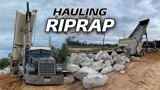 hauling RIPRAP STONE with a frameless end dump, SKETCHY spot to drop the loads 😱