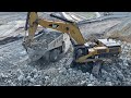 Caterpillar 385c excavator loading caterpillar 775e dumper and mercedesman trucks  pyramis ate